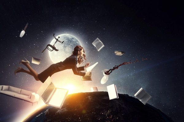 Woman floating in air surrounded by chair, books, papers